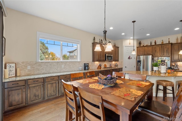 15003 W 63rd Ave, Arvada, CO 80403 - dining area with light wood-style floors and recessed lighting