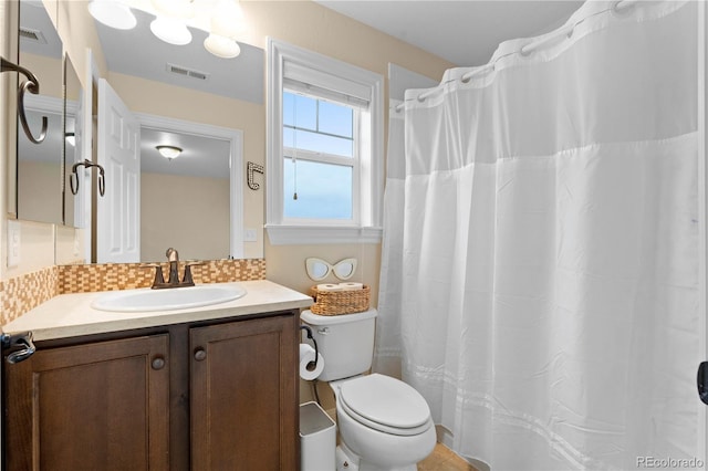 15003 W 63rd Ave, Arvada, CO 80403 - full bathroom featuring vanity, backsplash, and a shower with curtain