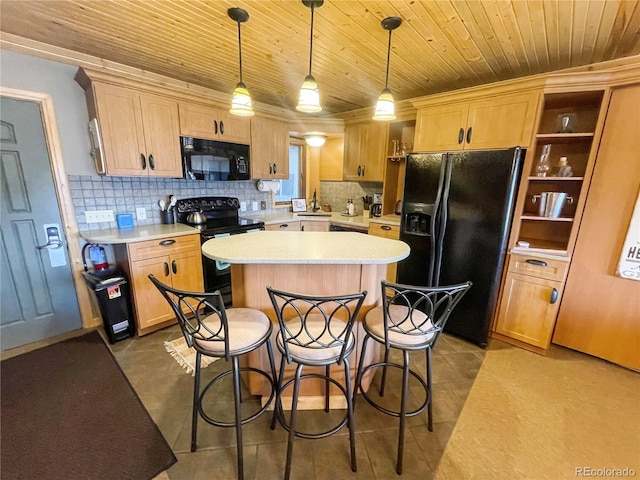 kitchen with tasteful backsplash, black appliances, wooden ceiling, pendant lighting, and a breakfast bar