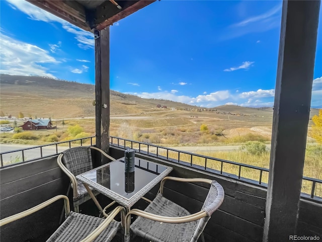 balcony featuring a rural view