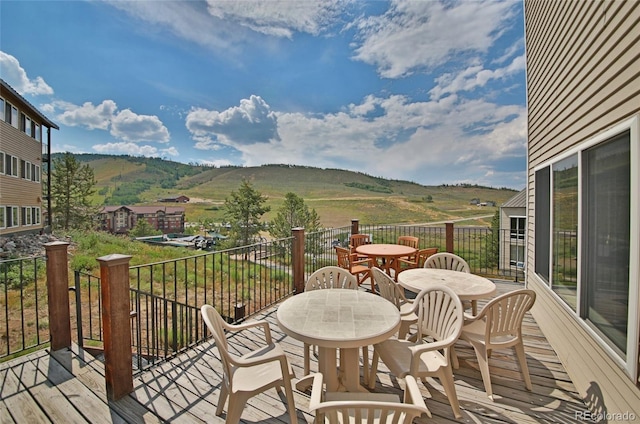 wooden deck featuring a mountain view