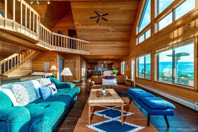 70 Sheep Creek Trl, Fairplay, CO 80440 - living room featuring high vaulted ceiling, wooden walls, wooden ceiling, wood finished floors, and a baseboard heating unit