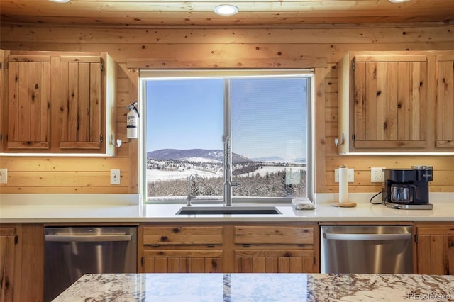 70 Sheep Creek Trl, Fairplay, CO 80440 - kitchen featuring stainless steel dishwasher, light countertops, wooden walls, and a mountain view