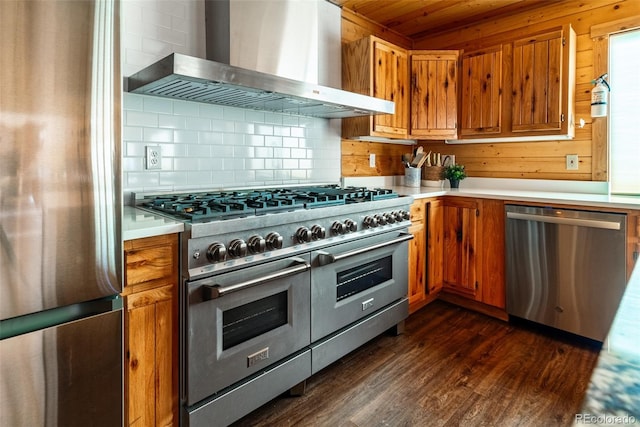 70 Sheep Creek Trl, Fairplay, CO 80440 - kitchen with appliances with stainless steel finishes, wall chimney exhaust hood, light countertops, tasteful backsplash, and wood ceiling