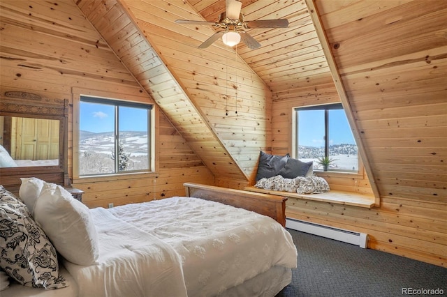70 Sheep Creek Trl, Fairplay, CO 80440 - bedroom with wooden walls, a baseboard radiator, multiple windows, carpet floors, and wooden ceiling