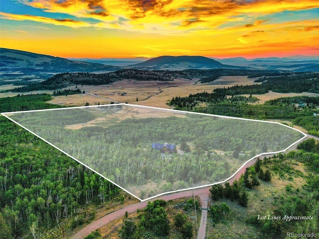 70 Sheep Creek Trl, Fairplay, CO 80440 - aerial view at dusk of property boundaries highlighted and a mountain view