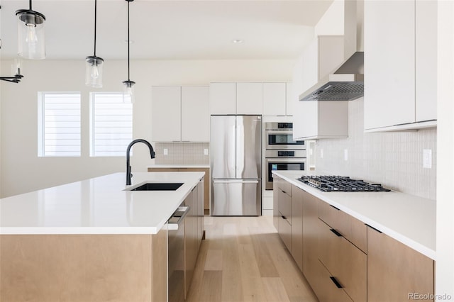 11324 Alla Breve Cir, Lone Tree, CO 80134 - kitchen with stainless steel appliances, wall chimney exhaust hood, light wood-type flooring, and modern cabinets