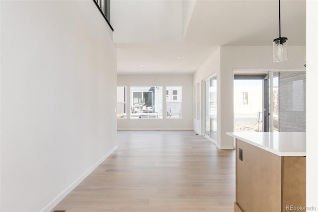 11324 Alla Breve Cir, Lone Tree, CO 80134 - corridor featuring baseboards and light wood finished floors