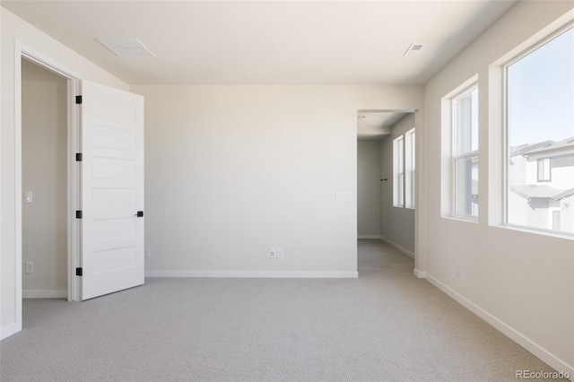 11324 Alla Breve Cir, Lone Tree, CO 80134 - spare room featuring light colored carpet and healthy amount of natural light