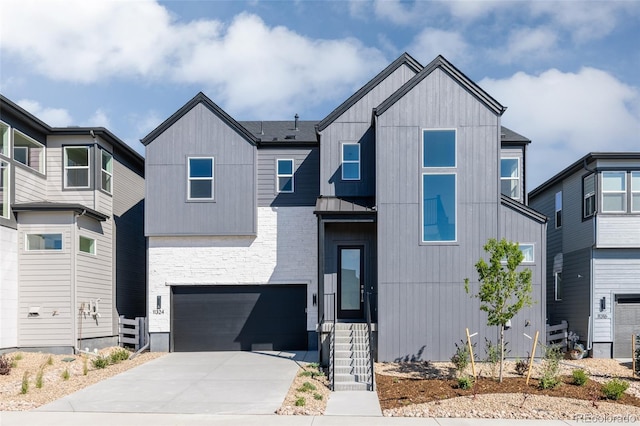 11324 Alla Breve Cir, Lone Tree, CO 80134 - view of front of house featuring an attached garage, driveway, a standing seam roof, and a metal roof
