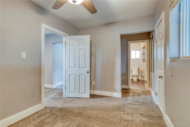 6660 Locust St, Commerce City, CO 80022 - unfurnished bedroom with ceiling fan, baseboards, carpet floors, and connected bathroom