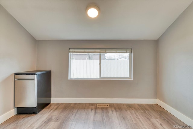 6660 Locust St, Commerce City, CO 80022 - empty room featuring visible vents, wood finished floors, and baseboards
