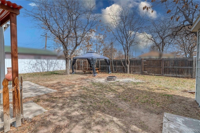 6660 Locust St, Commerce City, CO 80022 - view of yard with a gazebo, a fenced backyard, and a fire pit