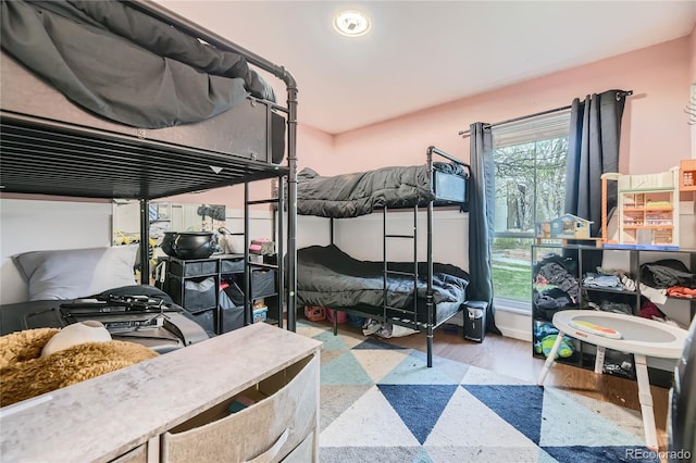 3550 S Harlan St Unit 311, Denver, CO 80235 - bedroom with wood finished floors