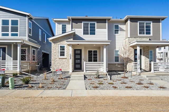 view of front of home with stone siding