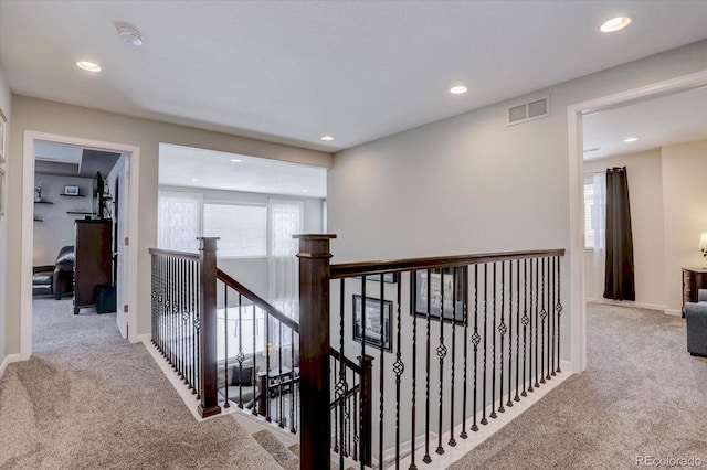 hallway with carpet flooring