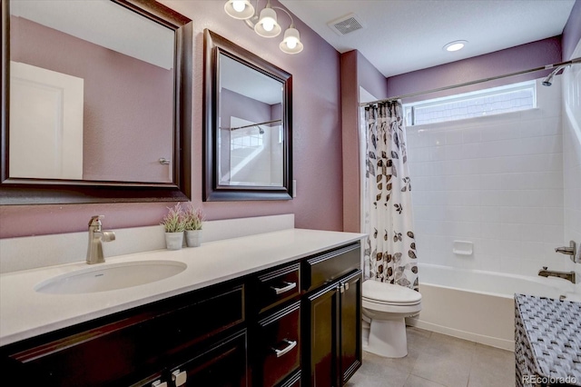 full bathroom featuring vanity, shower / bathtub combination with curtain, tile patterned floors, and toilet