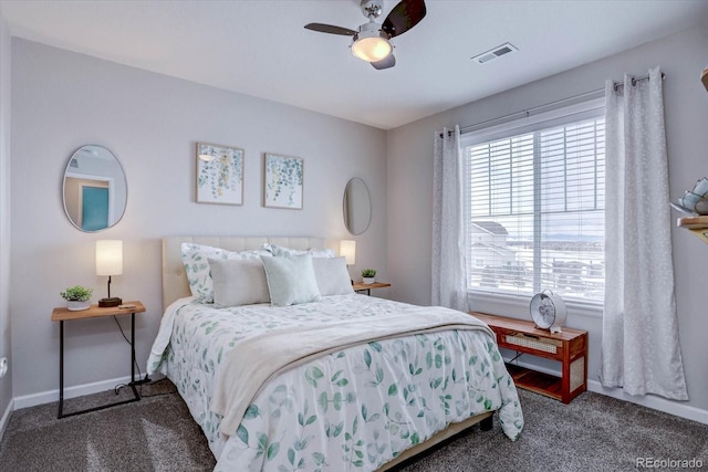 bedroom with dark carpet and ceiling fan