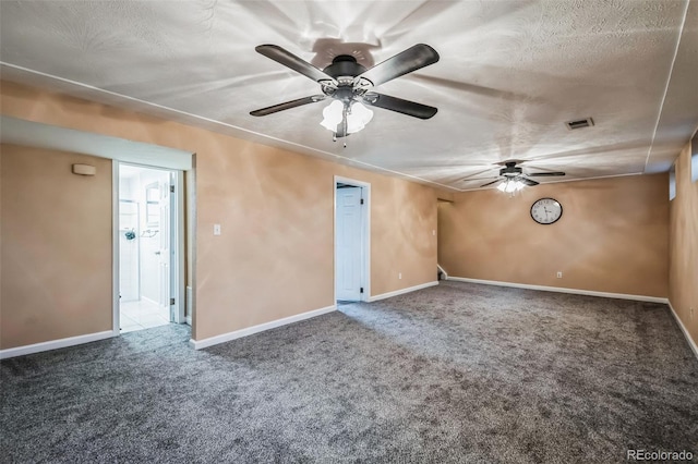 unfurnished room with a textured ceiling, ceiling fan, and carpet flooring