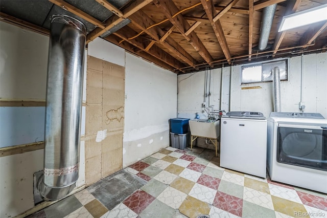 interior space with sink and washer and clothes dryer