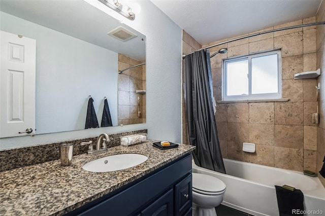 full bathroom featuring shower / bath combo with shower curtain, vanity, and toilet