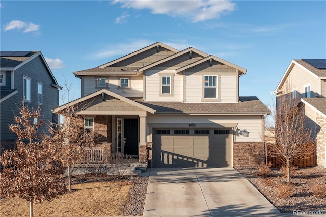 craftsman-style house featuring a garage, stone siding, driveway, and a porch