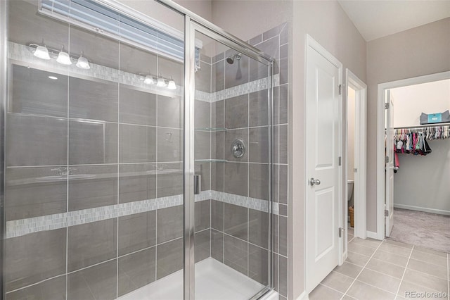 bathroom with tile patterned flooring and an enclosed shower