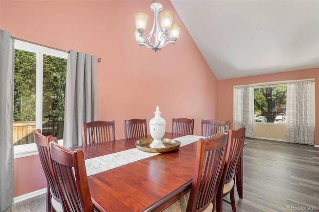 dining space featuring a healthy amount of sunlight, dark hardwood / wood-style floors, high vaulted ceiling, and a notable chandelier