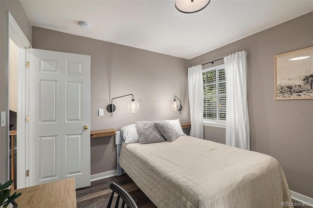 bedroom featuring dark hardwood / wood-style floors