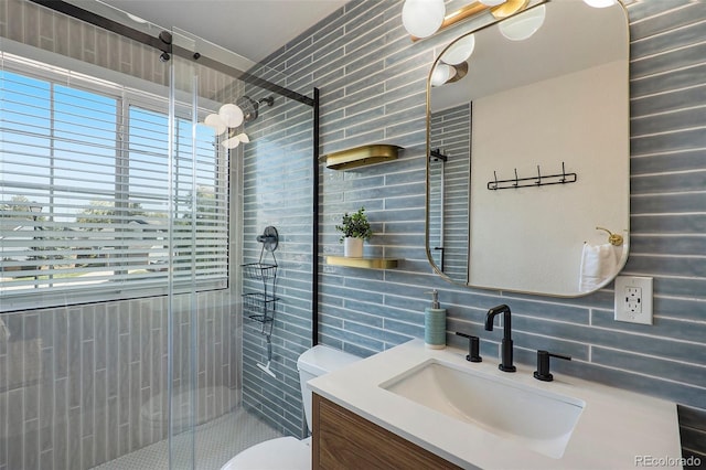 bathroom with an enclosed shower, tasteful backsplash, vanity, and toilet