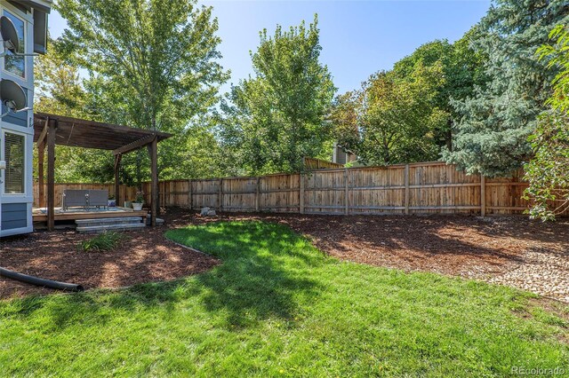 view of yard featuring a pergola and a wooden deck