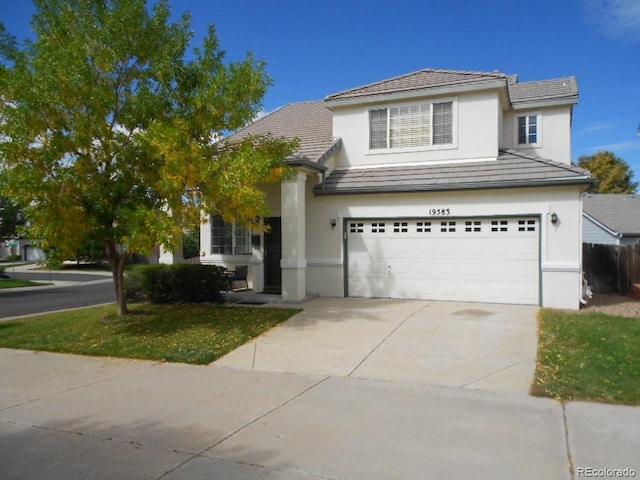 front of property with a garage