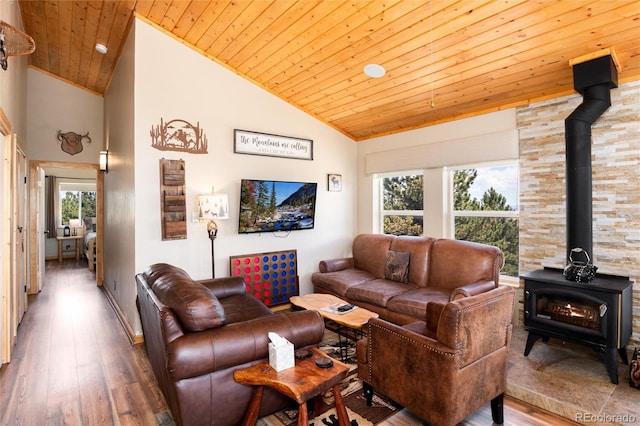 1301 Sheep Ridge Rd, Fairplay, CO 80440 - living area featuring a wood stove, wood ceiling, wood finished floors, healthy amount of natural light, and high vaulted ceiling