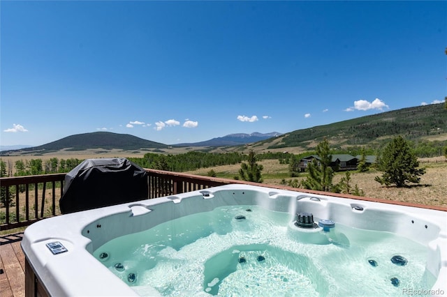 1301 Sheep Ridge Rd, Fairplay, CO 80440 - view of swimming pool with a hot tub, a deck with mountain view, and a grill