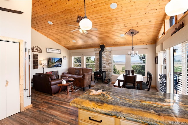 1301 Sheep Ridge Rd, Fairplay, CO 80440 - dining room with a wood stove, wooden ceiling, vaulted ceiling, dark wood-style flooring, and a ceiling fan