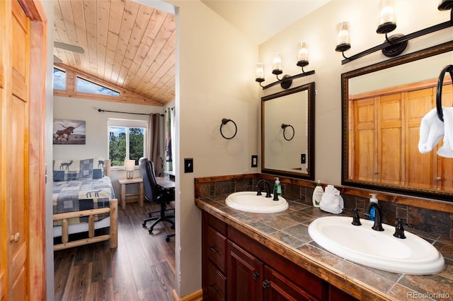1301 Sheep Ridge Rd, Fairplay, CO 80440 - ensuite bathroom with lofted ceiling, wood finished floors, double vanity, and wood ceiling