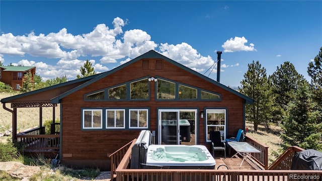 1301 Sheep Ridge Rd, Fairplay, CO 80440 - rear view of property with a hot tub and a deck