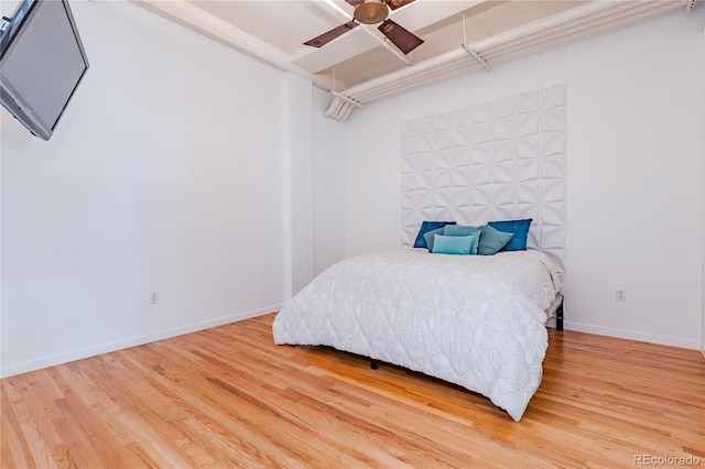 1555 California St Unit 605, Denver, CO 80202 - bedroom featuring wood finished floors, baseboards, and a ceiling fan