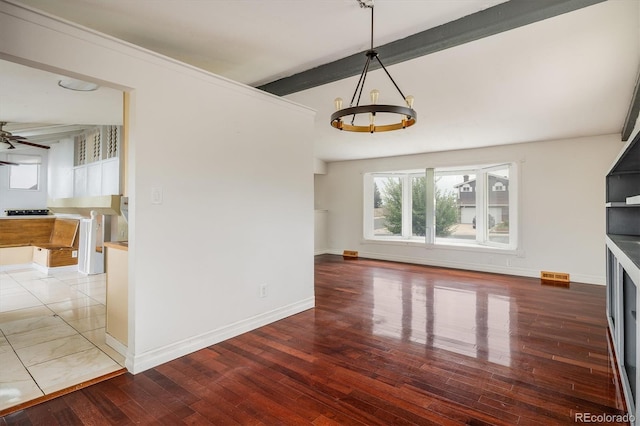 7210 Otis Ct, Arvada, CO 80003 - unfurnished living room with beam ceiling, a chandelier, wood finished floors, and a ceiling fan