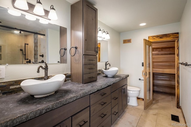 7210 Otis Ct, Arvada, CO 80003 - full bathroom with double vanity, a shower with shower door, and recessed lighting