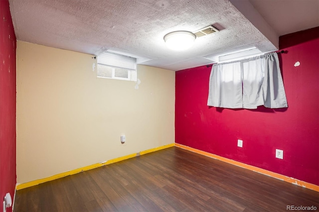 7210 Otis Ct, Arvada, CO 80003 - spare room with wood finished floors and a textured ceiling