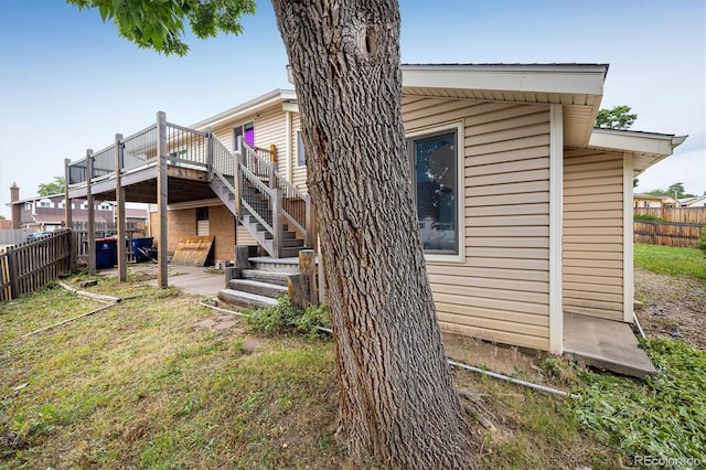 7210 Otis Ct, Arvada, CO 80003 - rear view of property with a wooden deck and stairway