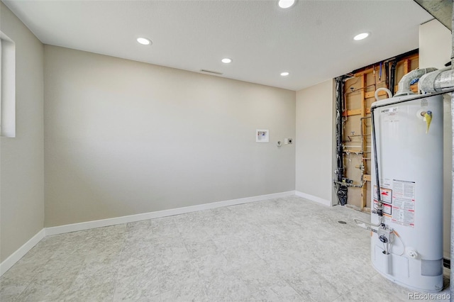 utility room featuring gas water heater