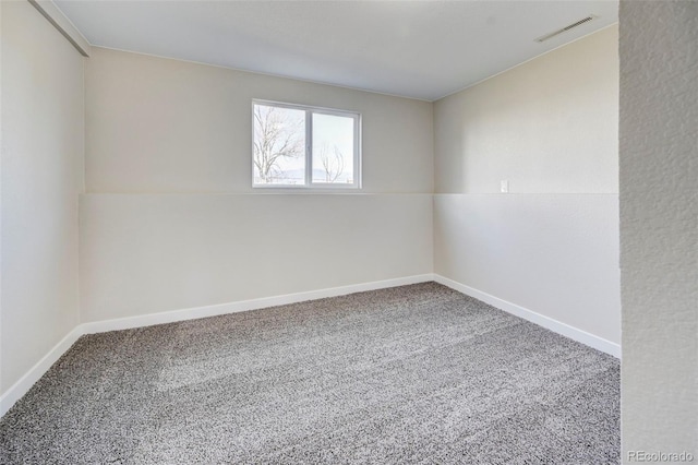 carpeted empty room with baseboards and visible vents