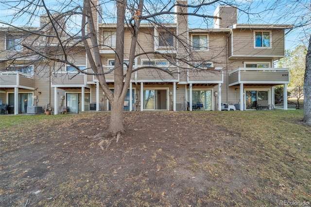 rear view of property with central air condition unit