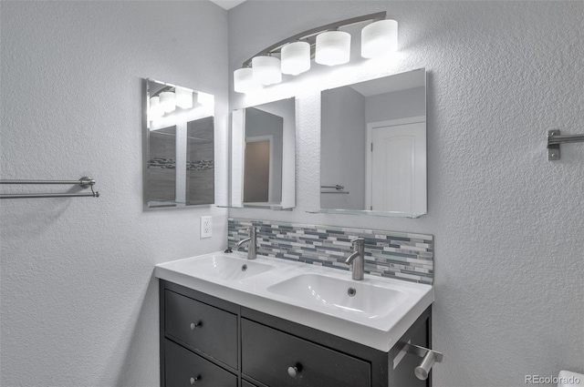 bathroom featuring vanity and decorative backsplash