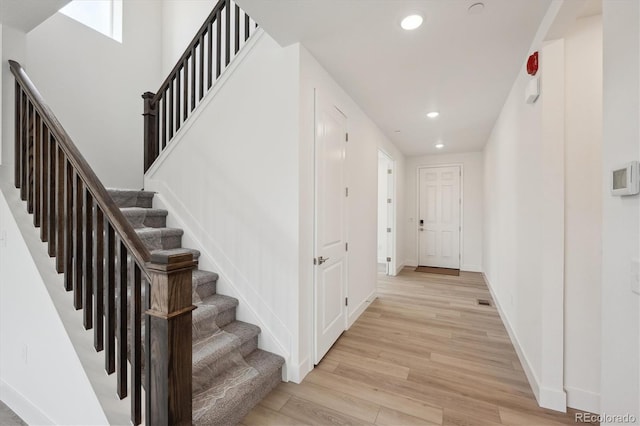 1376 Lumber Ridge Cir N, Erie, CO 80516 - stairs with recessed lighting, wood finished floors, and baseboards