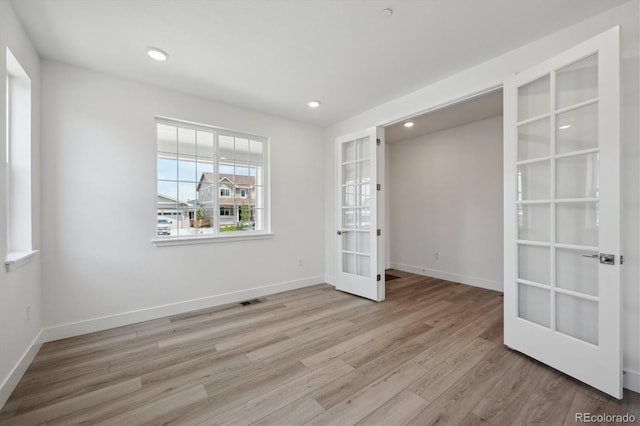 1376 Lumber Ridge Cir N, Erie, CO 80516 - unfurnished bedroom with french doors, wood finished floors, baseboards, and recessed lighting