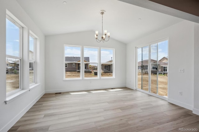 1376 Lumber Ridge Cir N, Erie, CO 80516 - unfurnished sunroom with plenty of natural light, a chandelier, and vaulted ceiling