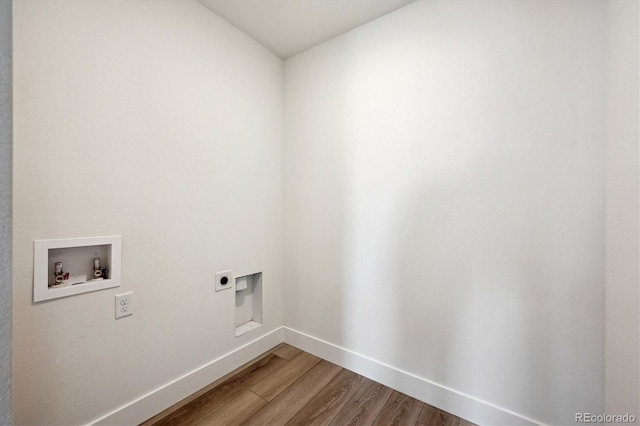 1376 Lumber Ridge Cir N, Erie, CO 80516 - laundry room featuring hookup for an electric dryer, hookup for a washing machine, light wood finished floors, and baseboards